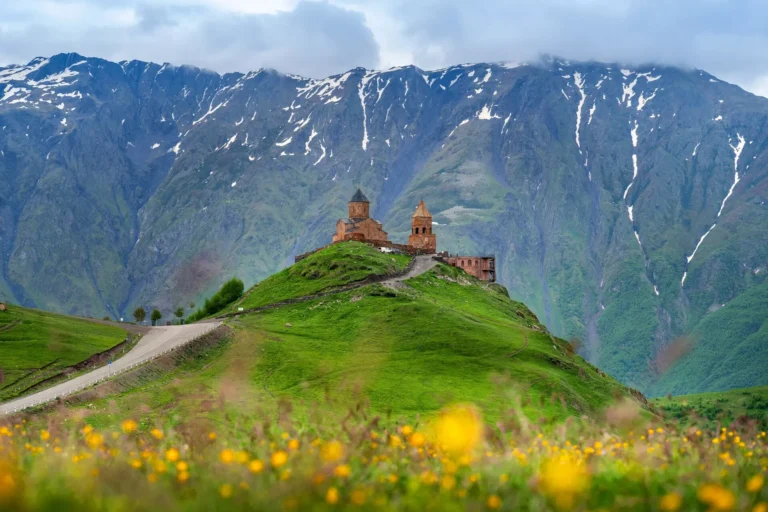 intrepid-travel-georgia-stepandsminda-gergeti-trinity-church-caucausus-mountains-shutterstock-2240197353