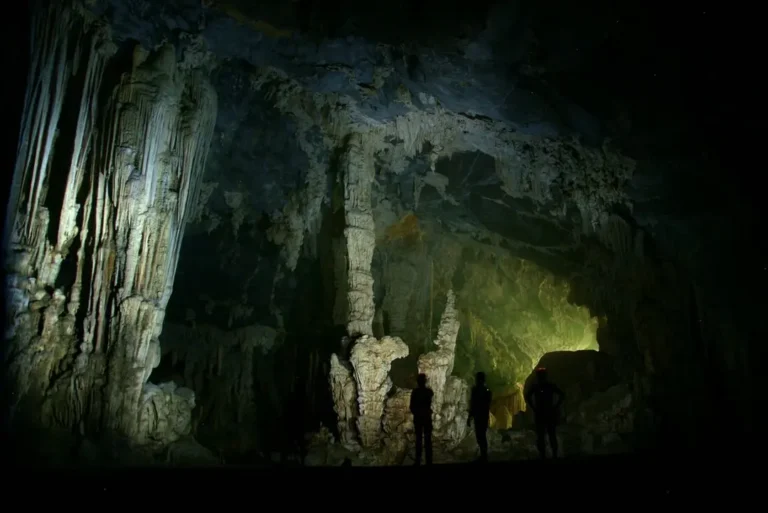 intrepid-travel-vietnam-phong-nha-tu-lan-caves-travellers-dark-shutterstock_1385642354
